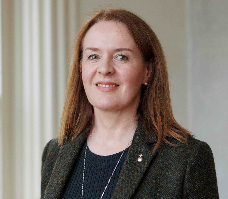 Woman with long hair dressed in black