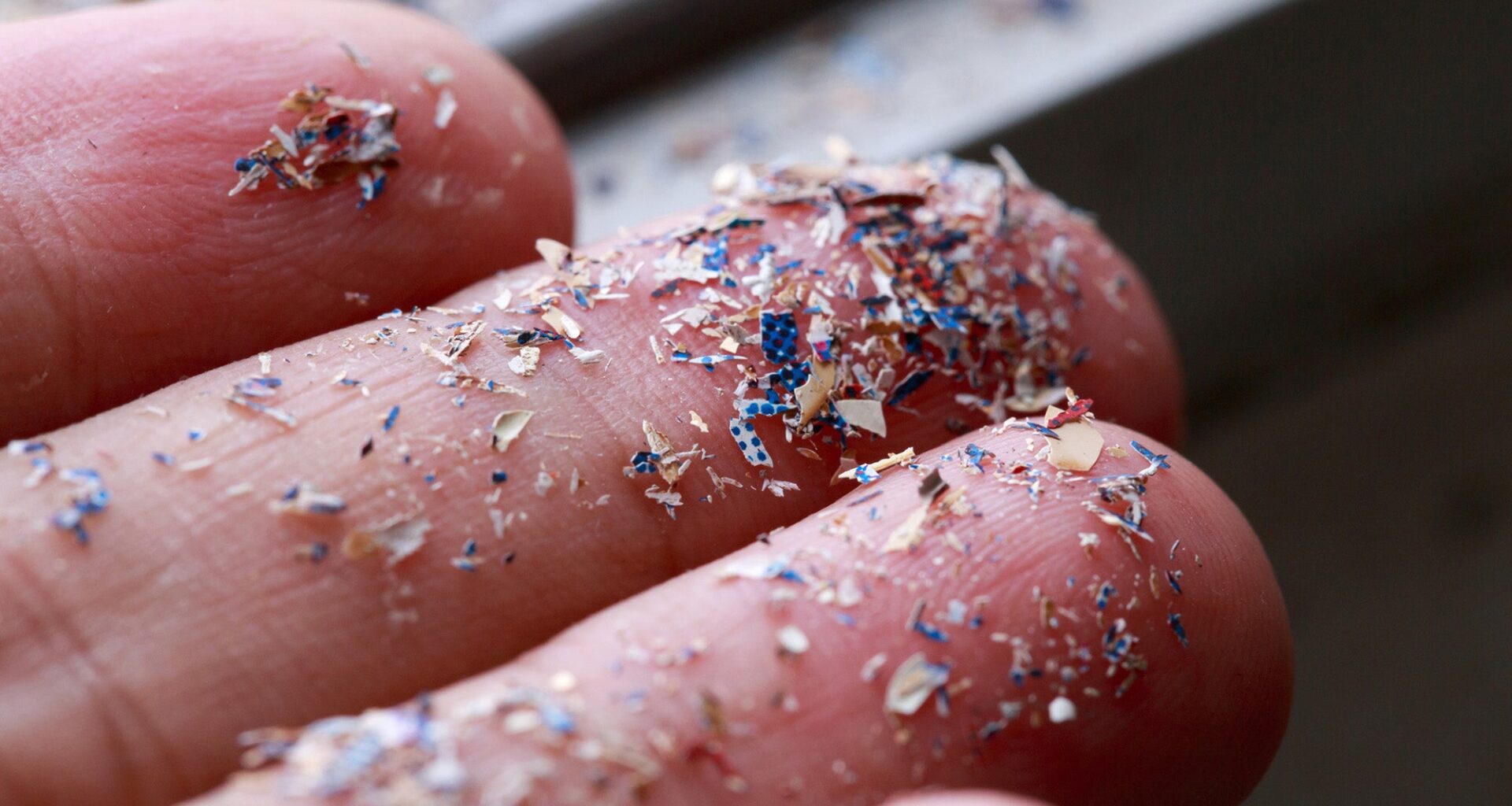 Close up shot of microplastics on a person's hand
