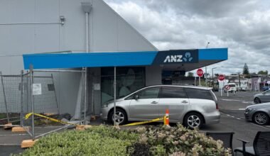 SunLive - Car crashes into bank building, damaging structure