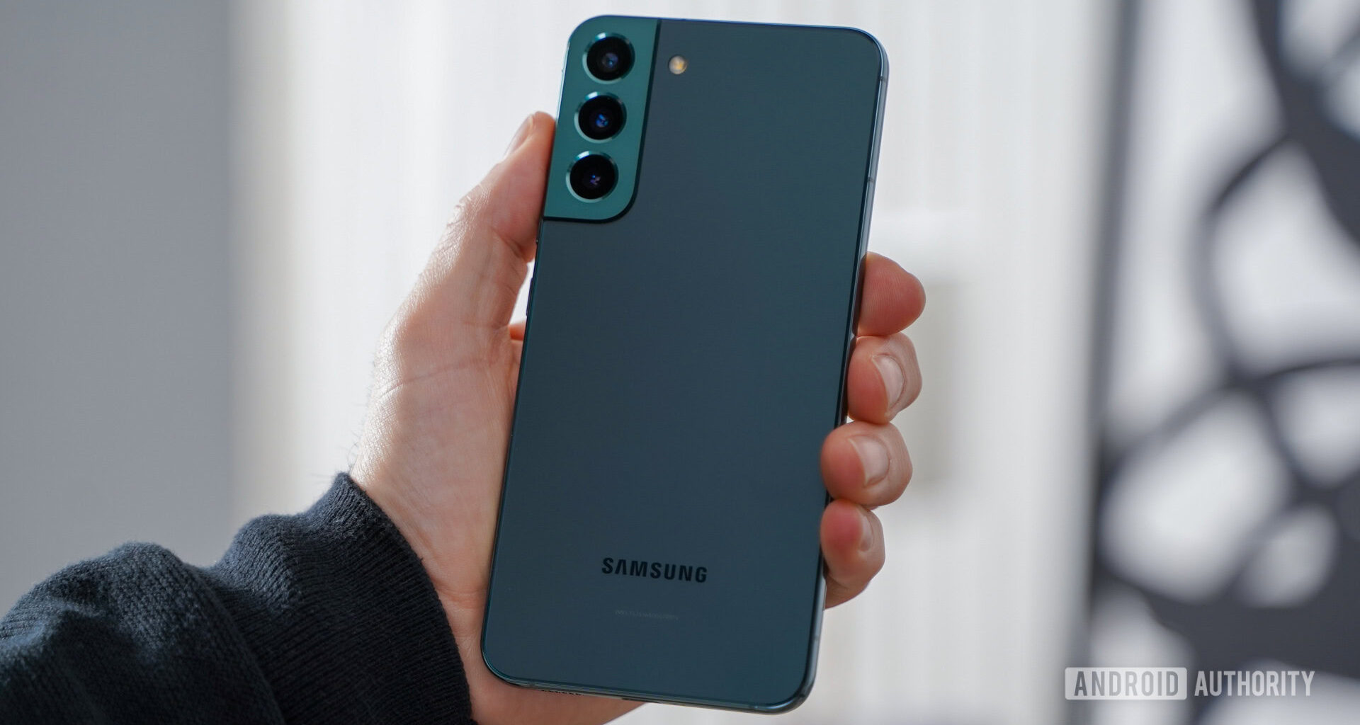 Samsung Galaxy S22 Plus angled in hand rear panel