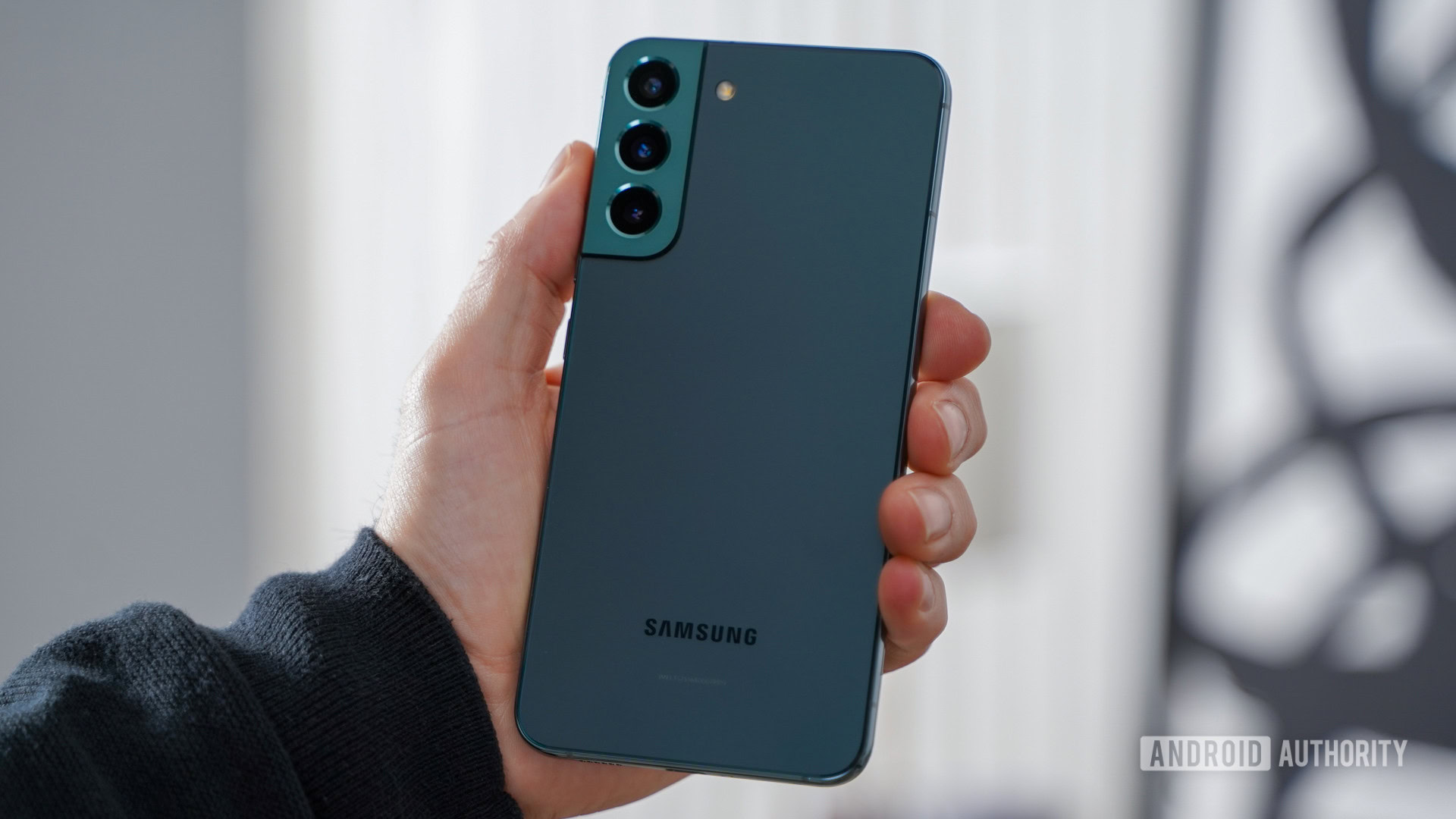 Samsung Galaxy S22 Plus angled in hand rear panel