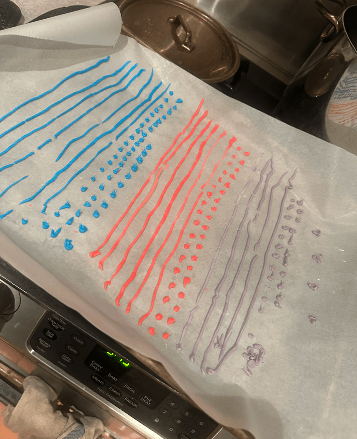 Blue red and purple sprinkles on butcher paper