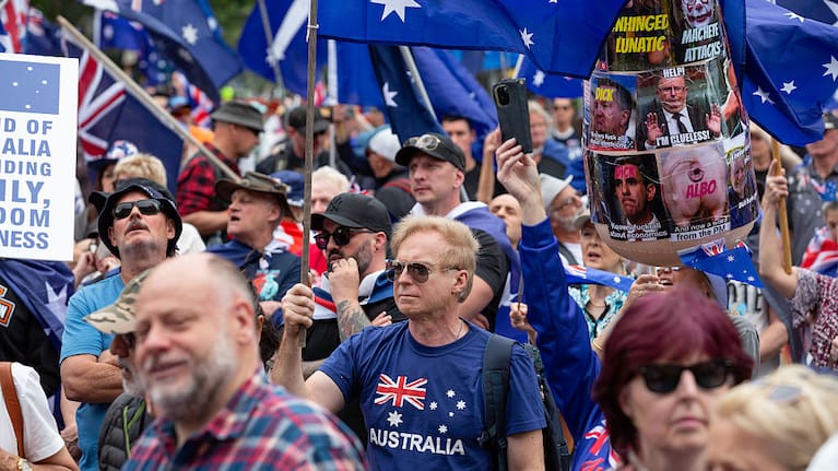 Counter protesters are kept at bay by a heavy police presence on October 19, 2025 in Melbourne, Australia.