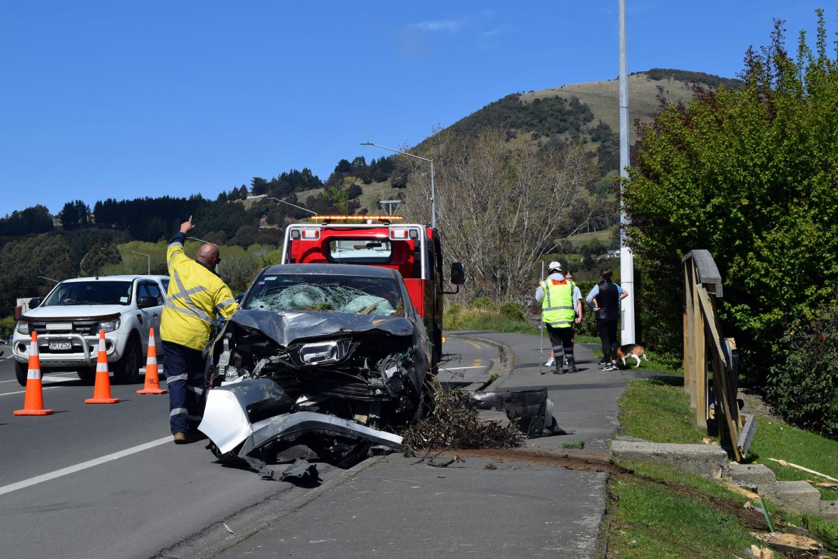 Driver hurt as car smashes through fence in Mosgiel