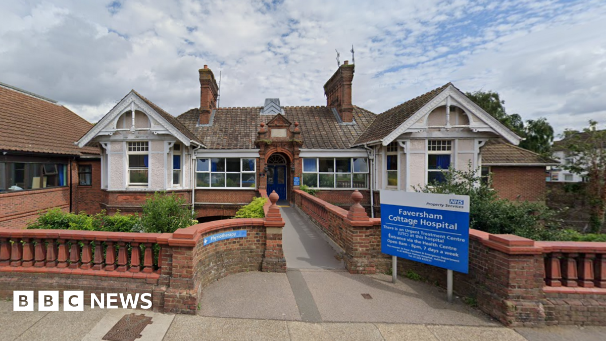 A single-storey building. There is a blue sign out the front which says "Faversham Cottage Hospital".