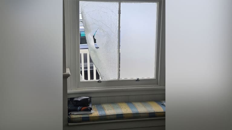 Debris lays scattered on a seat after a window of Winston Peters' house was smashed.