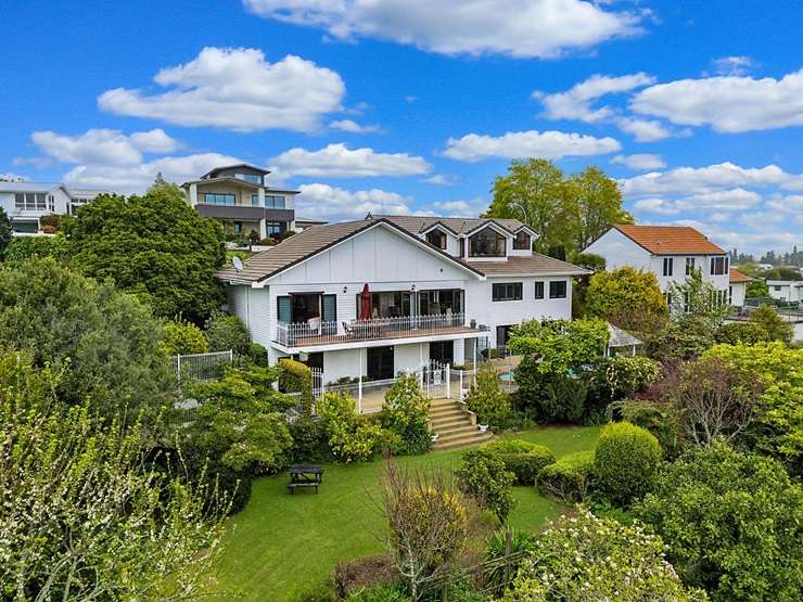 A five-bedroom home on 8160sqm with a pool and tennis court is one of the three properties overlooking Hamilton Lake for sale. Photo / Supplied