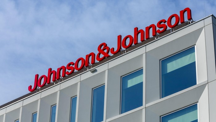 Johnson & Johnson building exterior with large red logo on modern white facade
