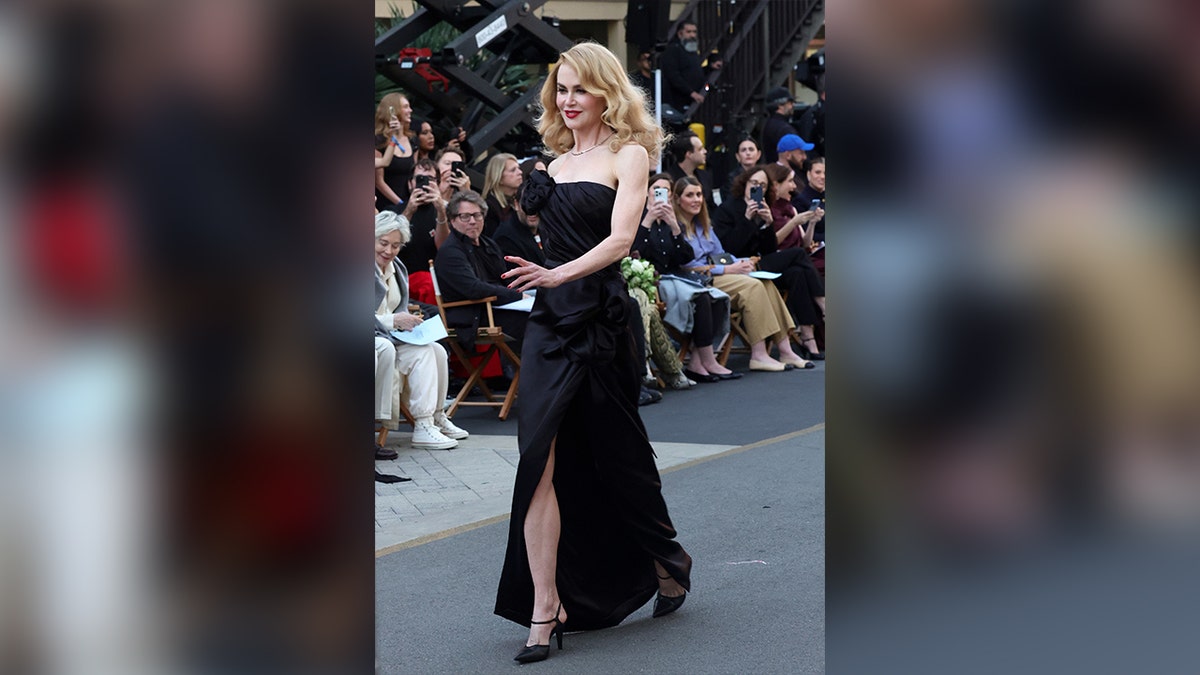 Nicole Kidman walks runway in black dress