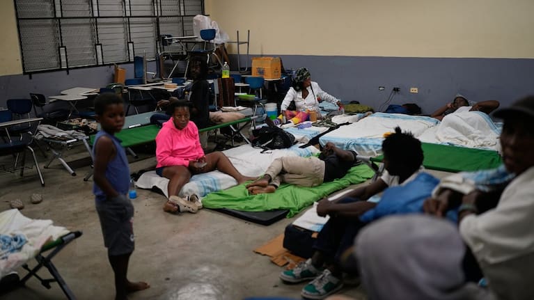 People take shelter in a school ahead of Hurricane Melissa's forecast arrival in Old Harbour, Jamaica.