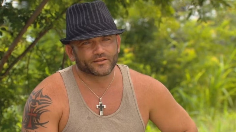 Russell in his fedora on Survivor