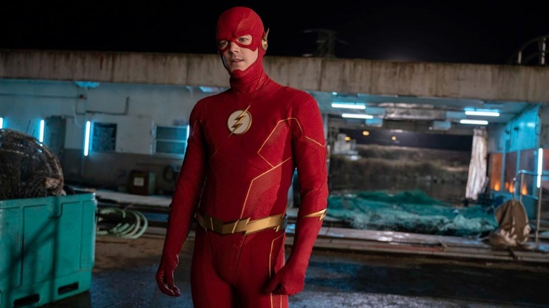 Barry Allen (Grant Gustin) is dressed as the Flash standing by a dumpster on The Flash (2014)