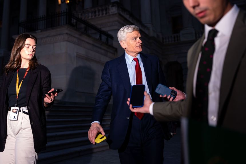 Sen. Bill Cassidy speaks with reporters as he departs the US Capitol on September 30.