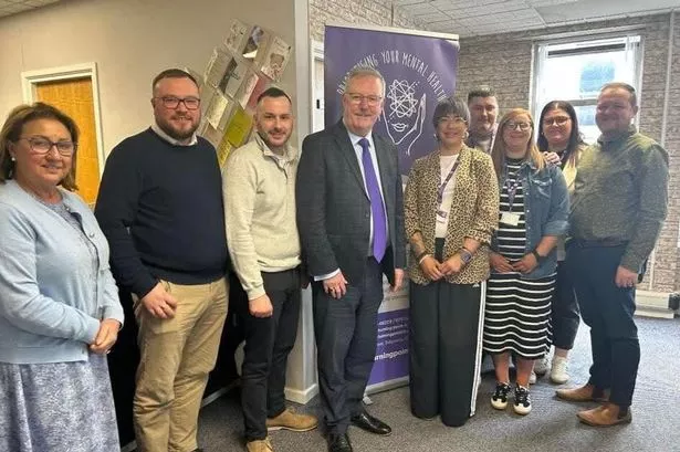 Staff at Turning Point NI with Health Minister Mike Nesbitt