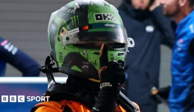 McLaren's Lando Norris holds up his right index finger in celebration after taking pole position for the Las Vegas Grand Prix