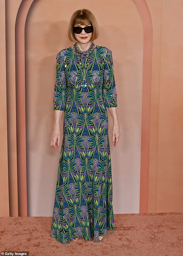 Anna Wintour was also in attendance and looked stylish in a green and purple patterned dress