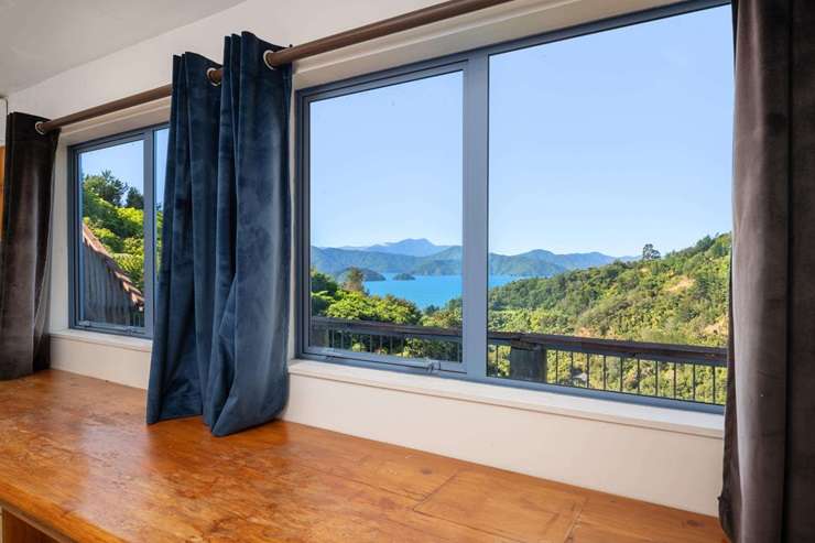 The two-bedroom home at 9 Cooks Ridge, in Waikawa, Marlborough, looks out to Queen Charlotte Sound. Photo / Supplied