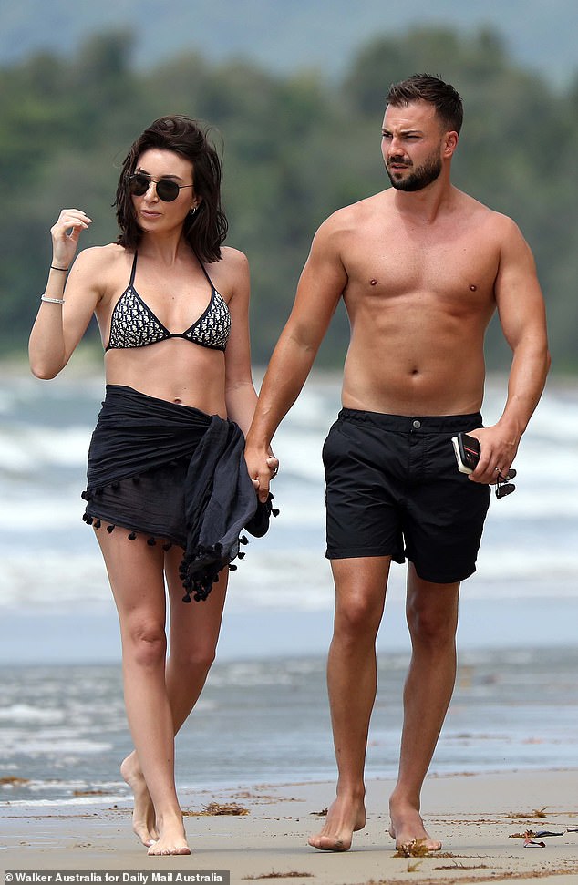 A bikini-clad Jess is seen with Roger on their honeymoon in Port Douglas in March 2021, a week after they married in Sydney