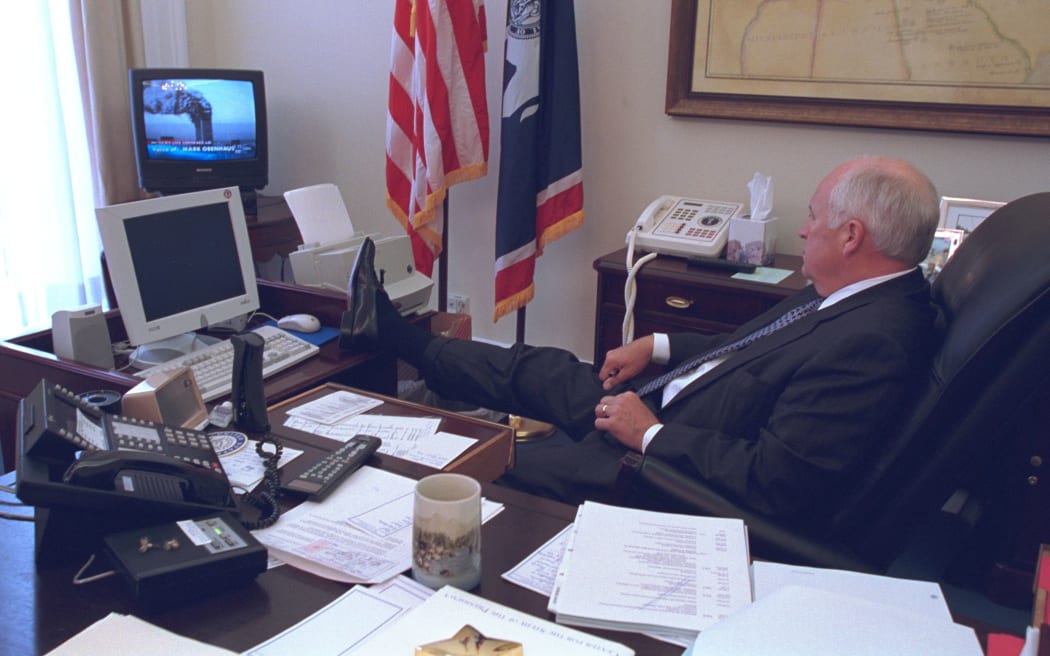 Cheney watches news coverage of the terror attacks on September 11, 2001.