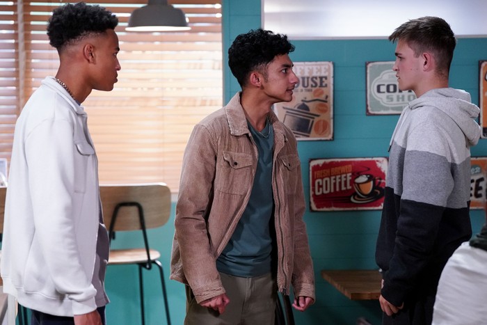 Denzel and Nugget square up to Tommy in the caff in EastEnders