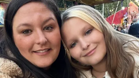 Family handout Mia pictured with her mother Chloe Hayes, both smiling with long hair.