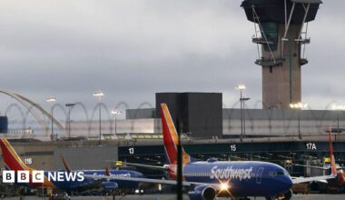 Hundreds of flights cancelled in US as airlines scramble to cut traffic during shutdown - live updates