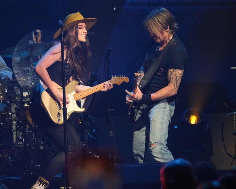 Maggie Baugh and Keith Urban perform onstage in 2023.