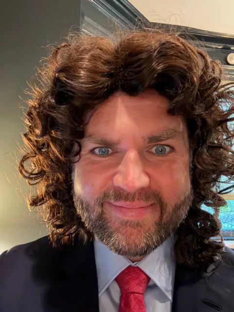 X/@JDVance JD Vance in a wig and suit with his eyes wide open