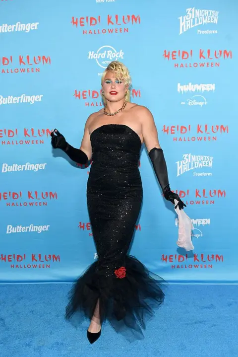 Getty Images Olympian Ilona Maher is seen wearing a black dress with frills at the bottom 