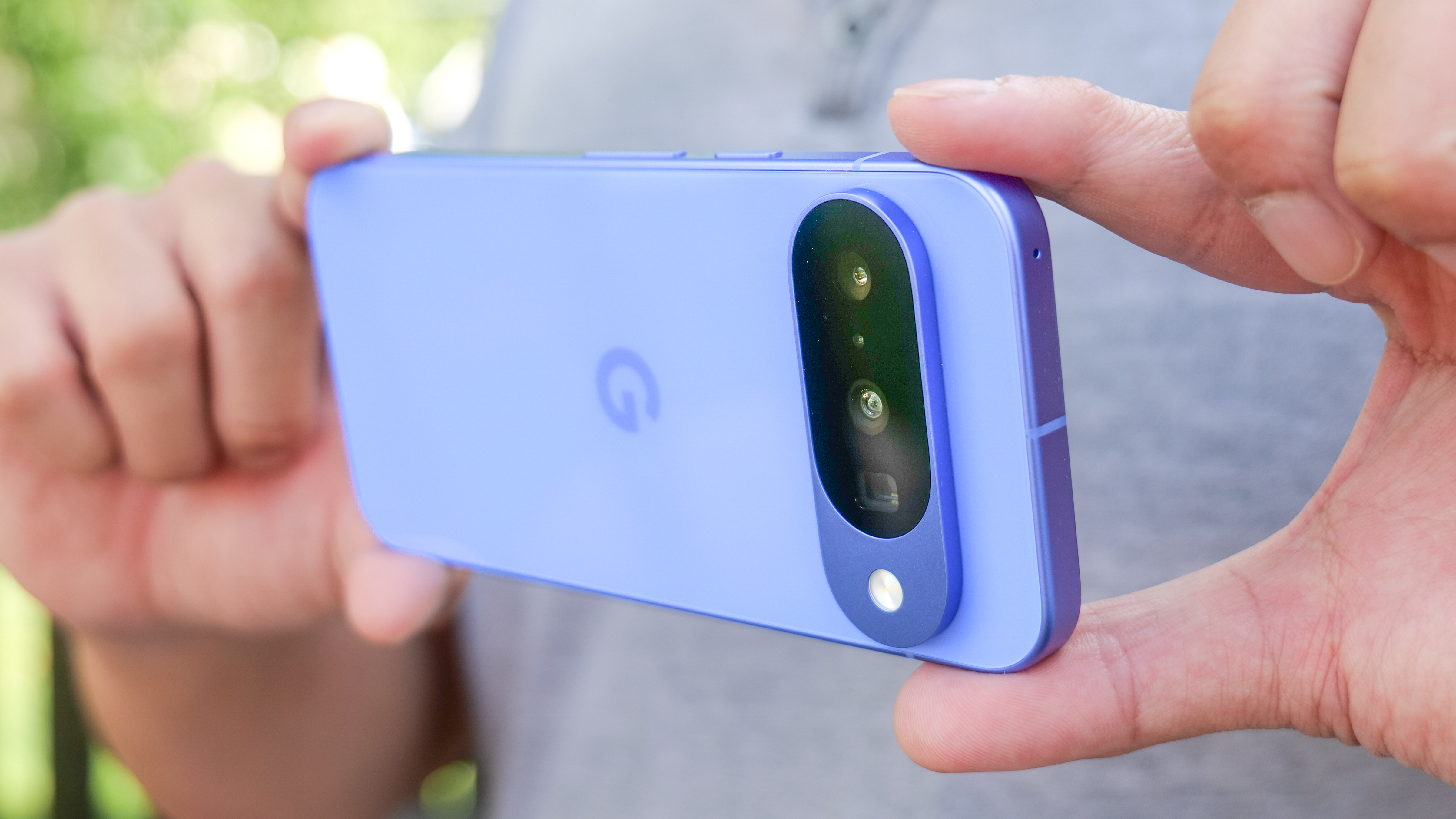 Google Pixel 10 in the hand.