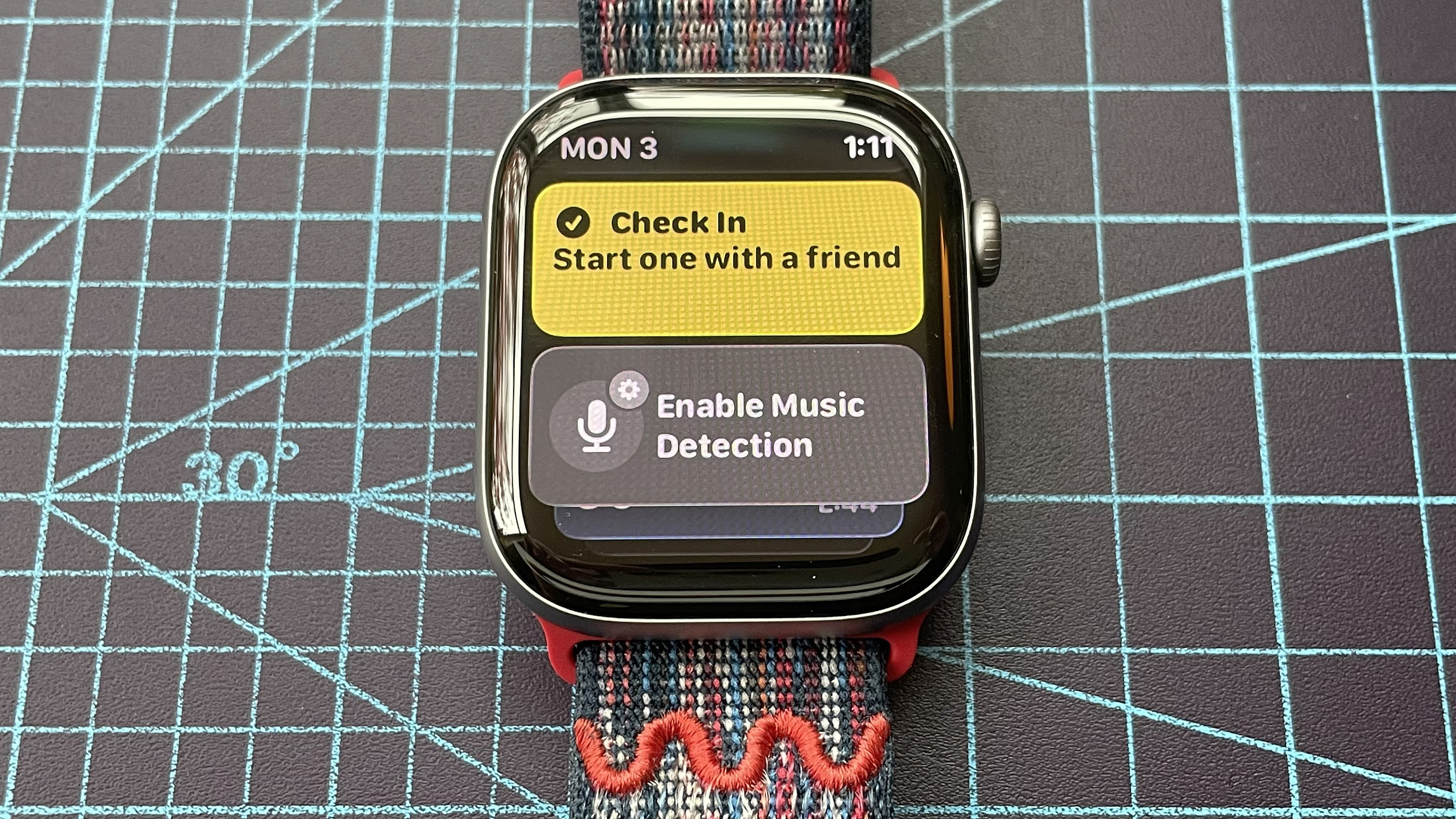 Detail shot of an Apple Watch Series 11 showing the steps to set up and send a Check In safety notification in watchOS 26