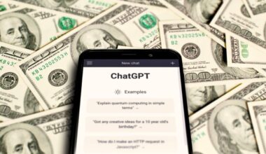 Chatgpt On A Smartphone Against A Backdrop Of Dollars
