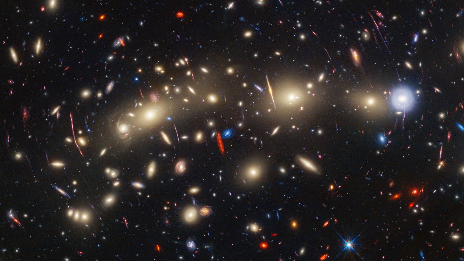 an image of many colorful stars and galaxies in outer space
