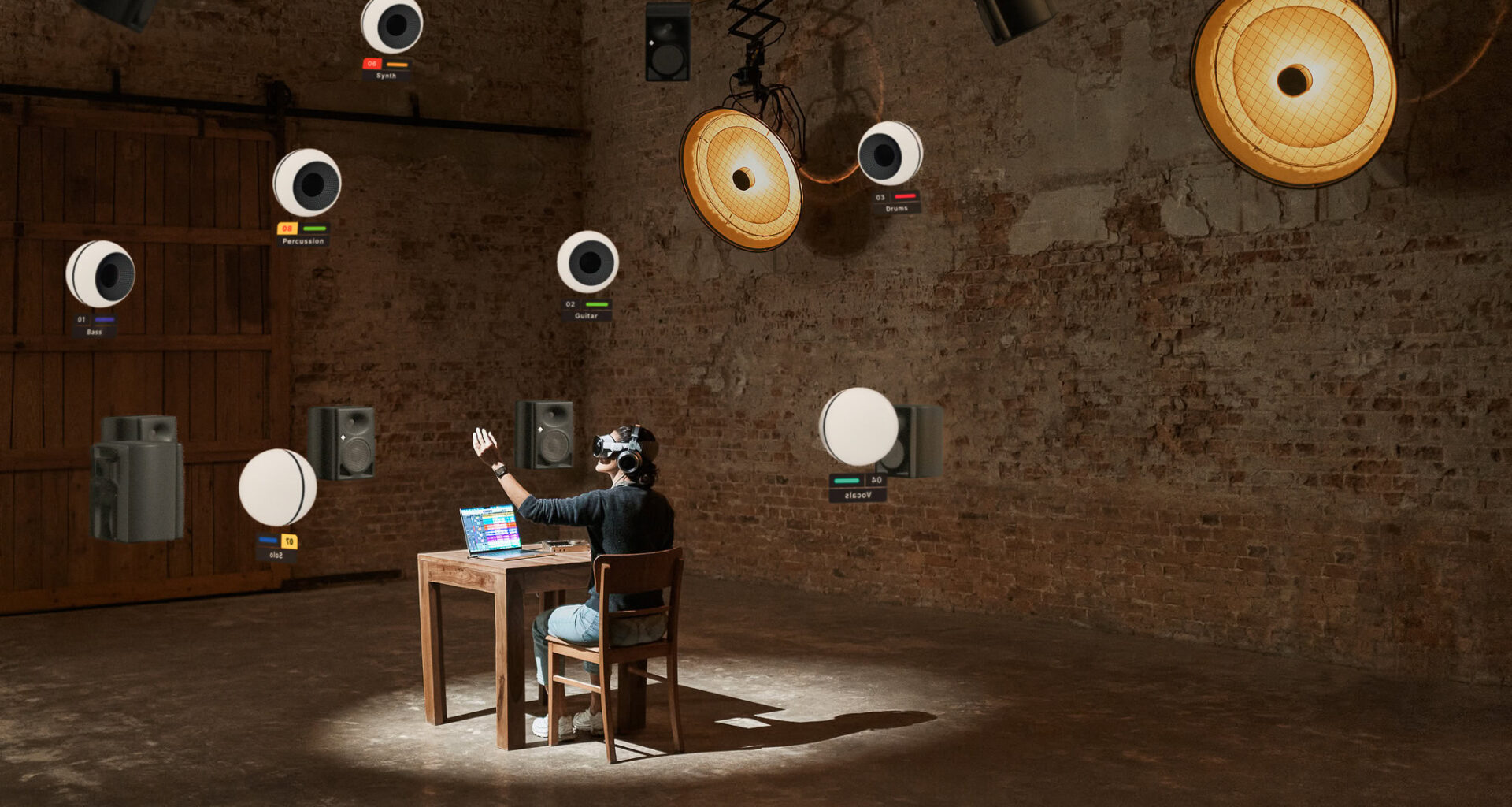 Person in a chair with a desk in front of them moving virtual objects around.