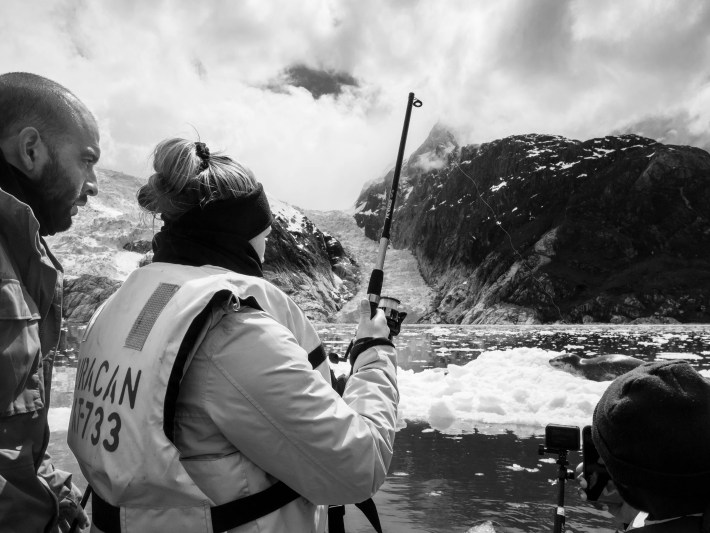 a photo of Renato Borras-Chavez and Emily Sperou working in the field at the lagoon in Chile