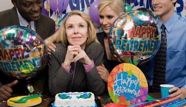 Content white businesswoman being congratulated by colleagues at her retirement party