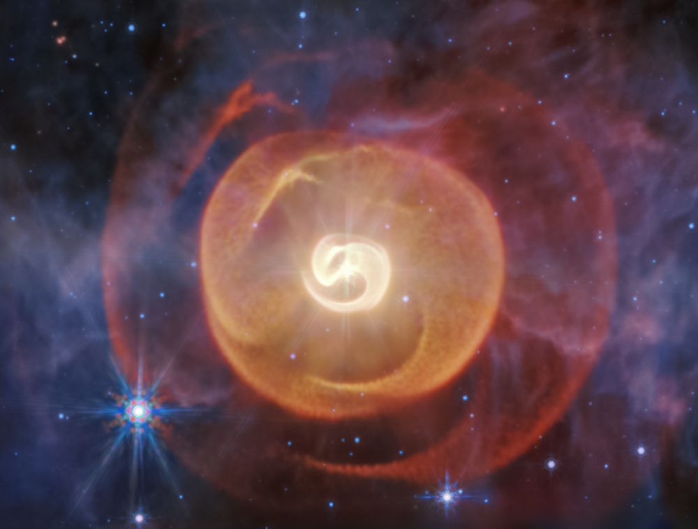 Dust shells like coiled serpents wrap themselves aroud Apep, a triple star system dominated by a pair of Wolf-Rayet stars. The JWST revealed their presence for the first time. Image Credit: NASA, ESA, CSA, STScI; Science: Yinuo Han (Caltech), Ryan White (Macquarie University); Image Processing: Alyssa Pagan (STScI)