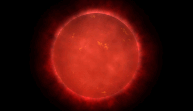 An illustration of a red giant star, where it glows red with heat in space