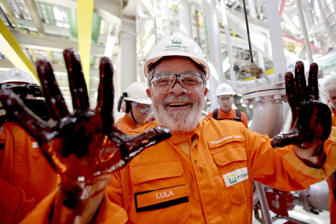 Brazil's President Luiz Inácio Lula da Silva shows his hands covered in oil during his visit to a Petrobras offshore ship platform off the coast of Rio de Janeiro, Brazil in 2010.