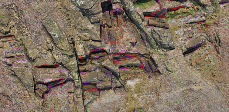 a stone hillside with multiple carvings with colored line annotations