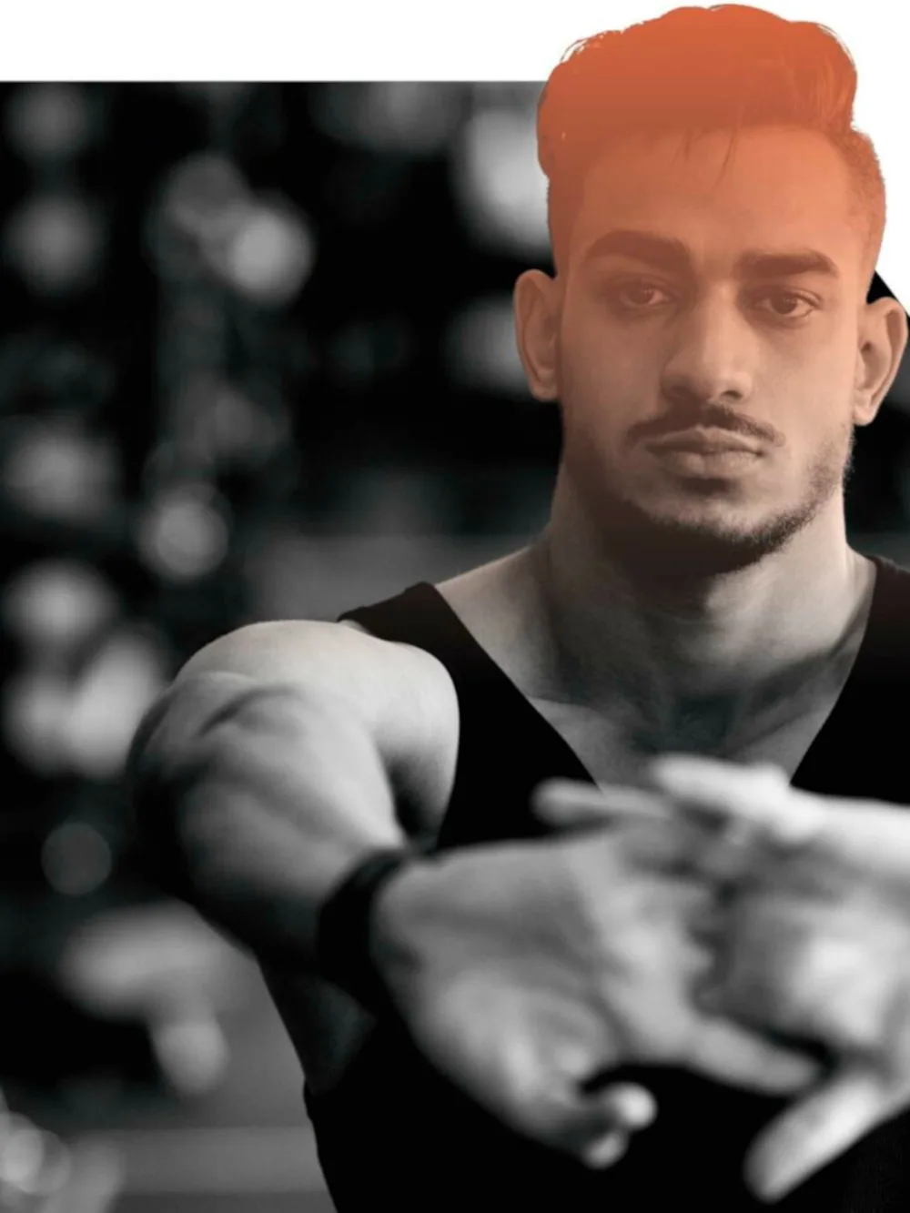 Photo of a person stretching their hands towards the camera, fingers locked, palms facing towards us