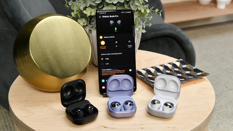 Samsung Galaxy Buds Pro placed beside Galaxy S21 phone