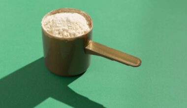 A scoop of protein against a green background