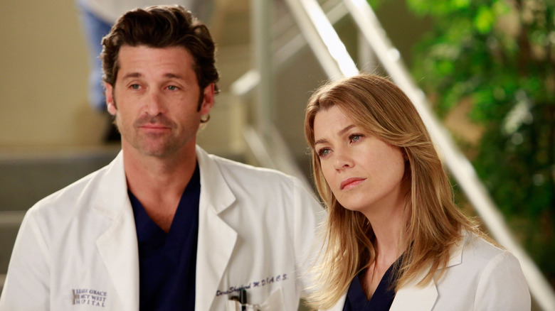 Dr. Derek Shepherd (Patrick Dempsey) and Dr. Meredith Grey (Ellen Pompeo) posing together on Grey's Anatomy