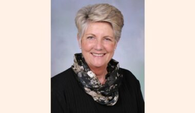 Head and shoulders photo of smiling Sharon Camp