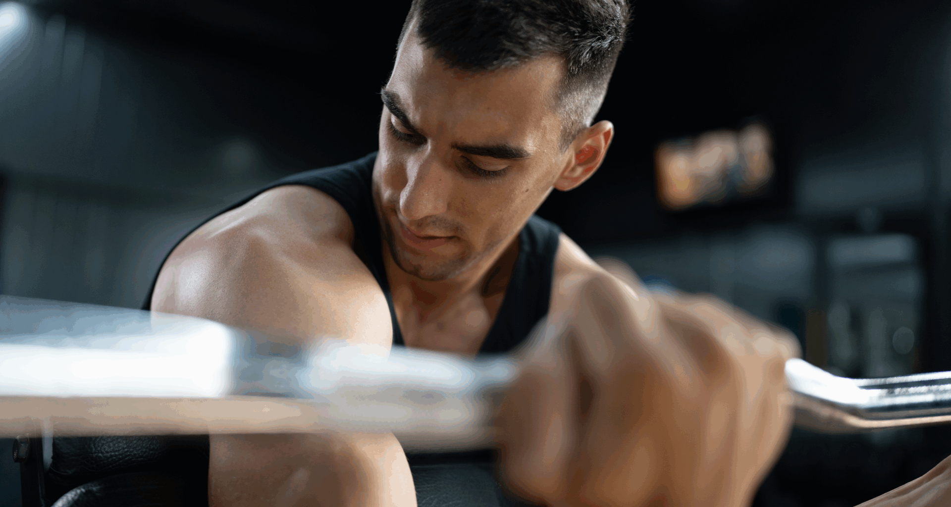 A man doing concentration curls