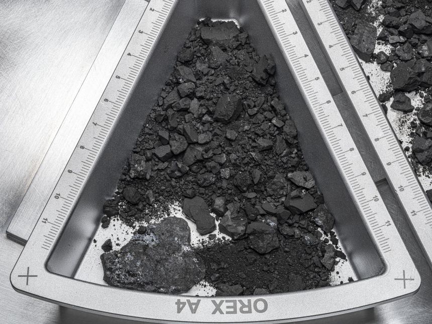 A container holding rocks and dust from asteroid Bennu.