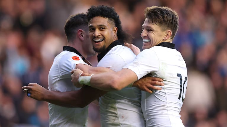 Leicester Fainga'anuku celebrates Will Jordan's try against Scotland with Jordan, left, and Beauden Barrett.