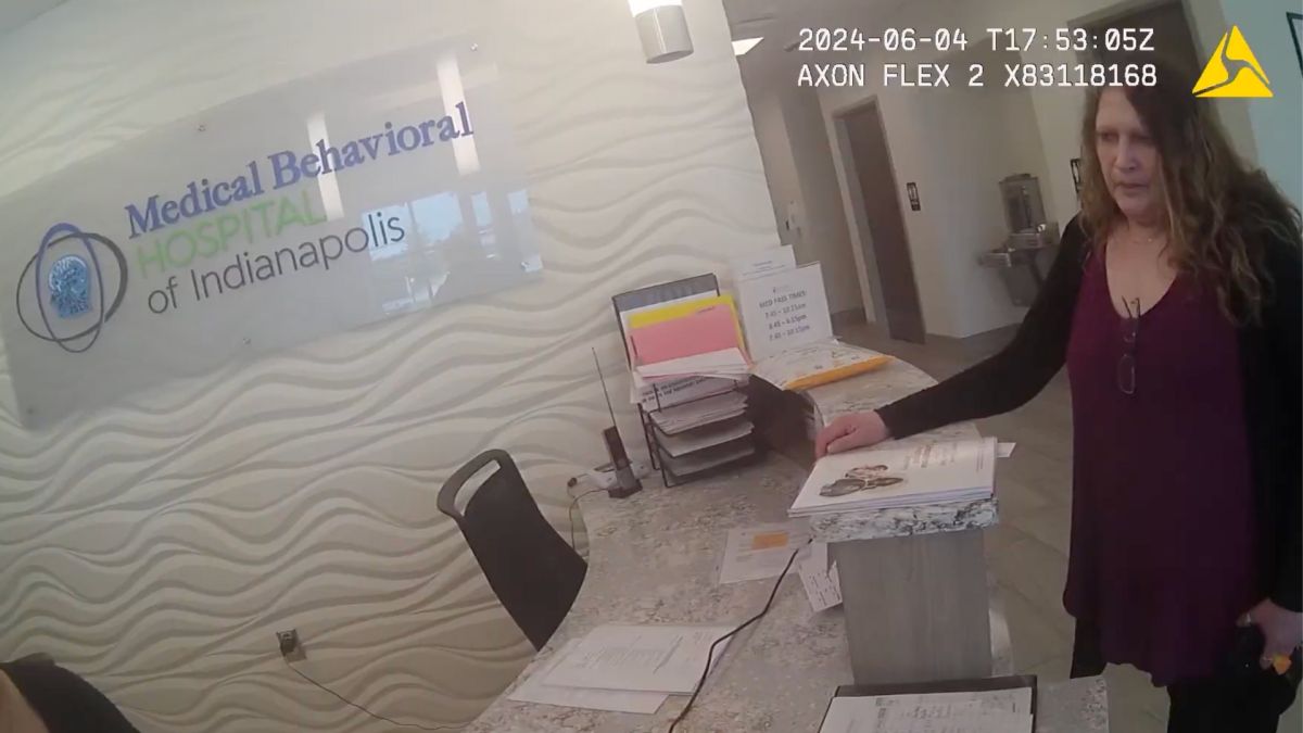 Tina Blackburn, Jessica Ravellette’s mother, speaks to staff at the Medical Behavioral Hospital of Indianapolis in Greenwood with a Greenwood police officer on Tuesday, June 4, 2024.