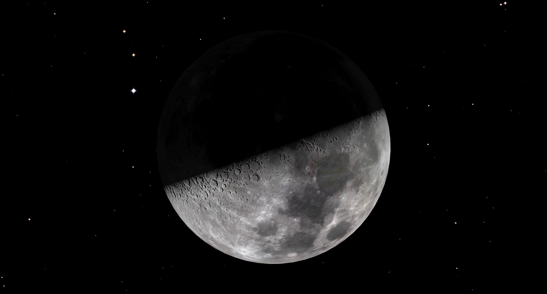 A close up of the moon in space with a shadow across its top half.